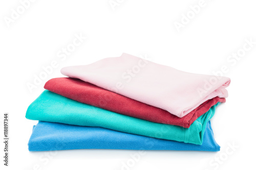Pile of colorful clothes isolated on white background.