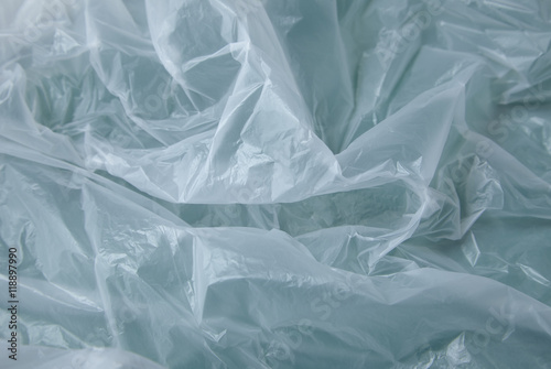 A full page of white polythene bag texture on a green background photo