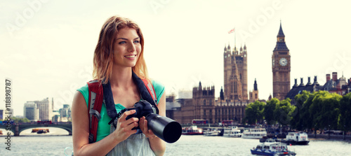 Photography woman with backpack and camera over london big ben