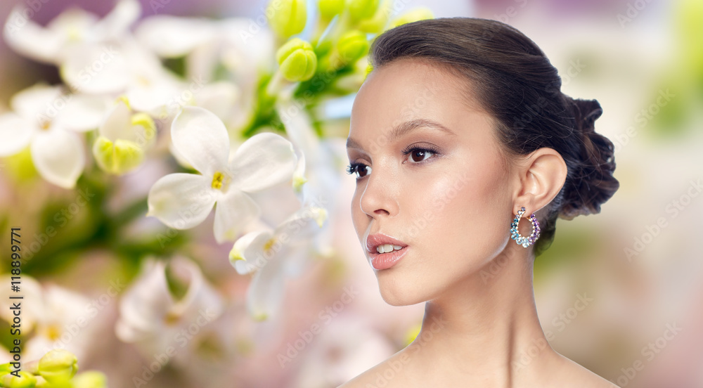 close up of beautiful woman face with earring close up of beautiful woman face with earring