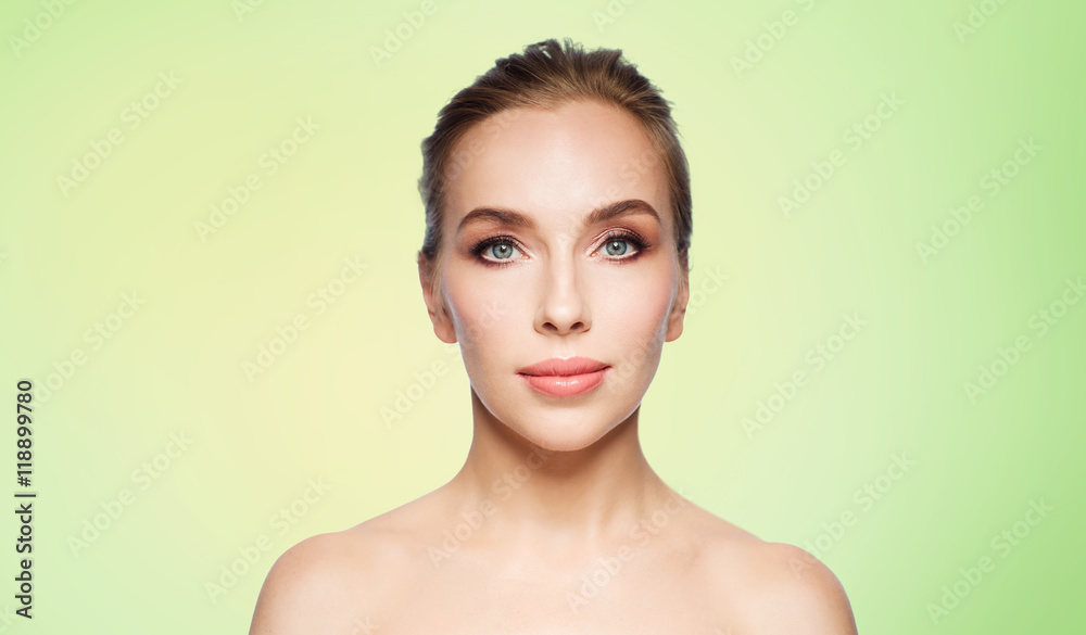 beautiful young woman face over white background beautiful young woman face over white background