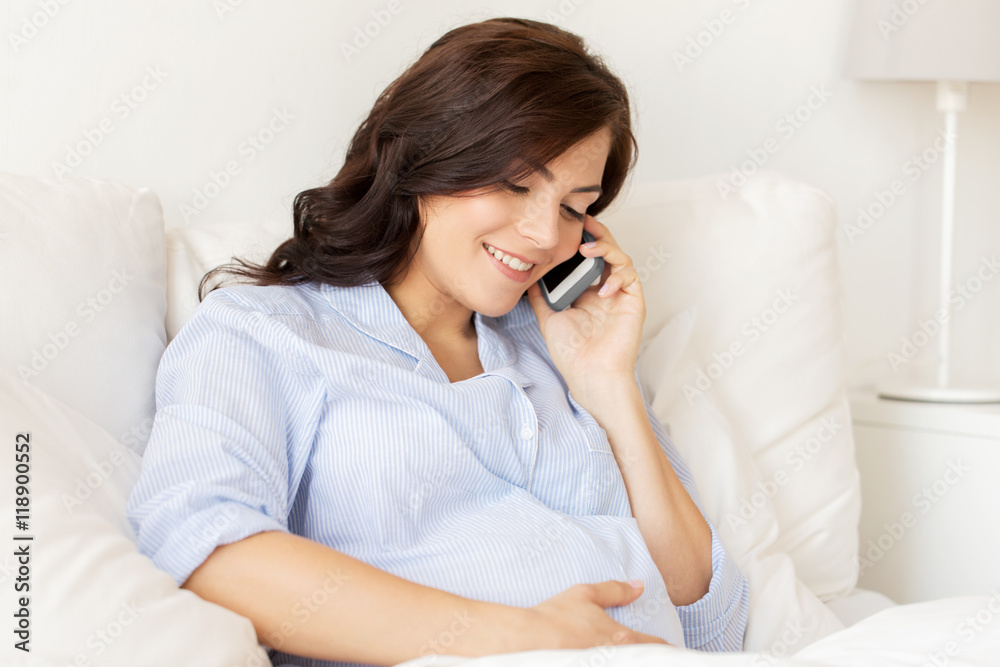 happy pregnant woman calling on smartphone at home happy pregnant woman calling on smartphone at home
