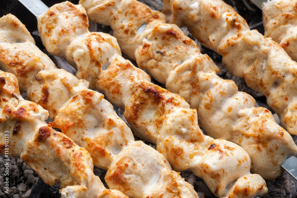 Barbecue skewers with meat on the brazier. Grill chicken shish kebab Barbecue skewers with meat on the brazier. Grill chicken shish kebab