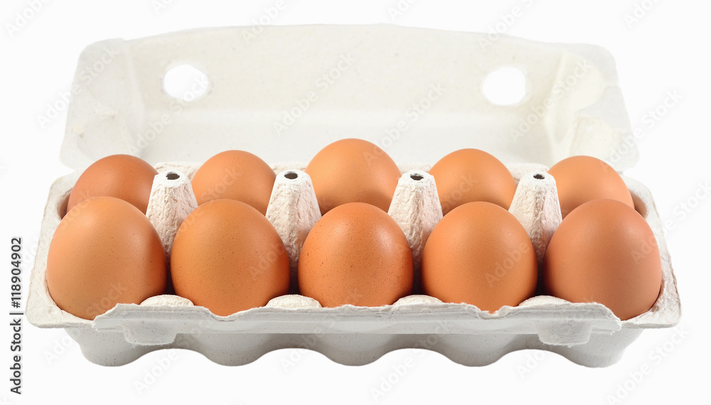 Carton of fresh brown eggs on a white
