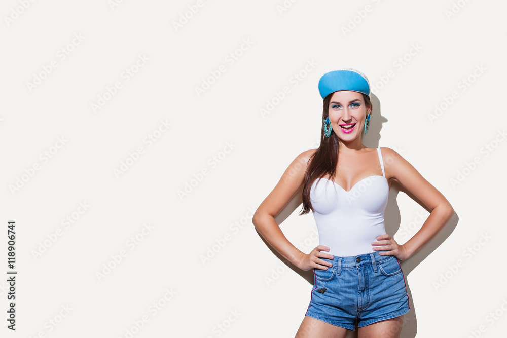 Young funny girl in a bright summer outfit smiling Young funny girl in a bright summer outfit smiling
