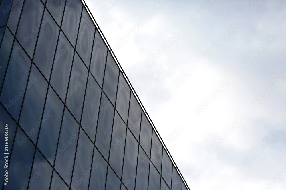 glass facade of the building against the sky