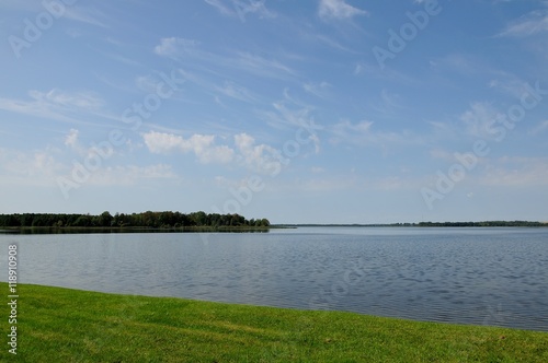 coastline of the lake under the blue sky