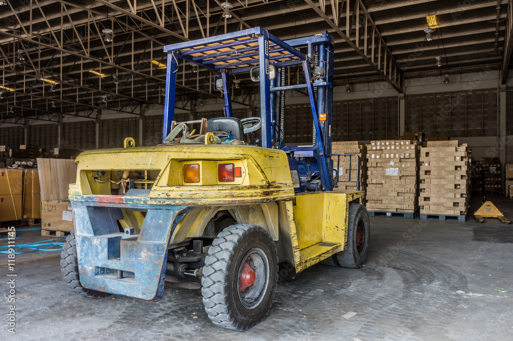 Rear of old forklift vehicle used in industrial warehouse. It is also called lift or fork truck.