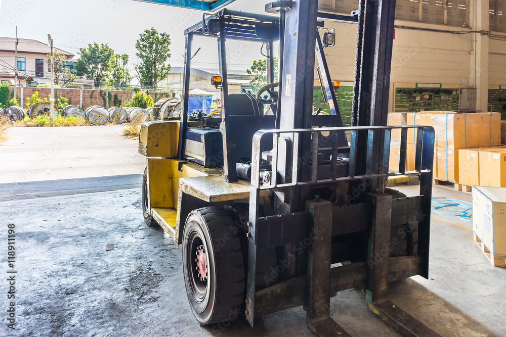 Front of old forklift vehicle used in industrial warehouse. It is also called lift or fork truck. Front of old forklift vehicle used in industrial warehouse. It is also called lift or fork truck.