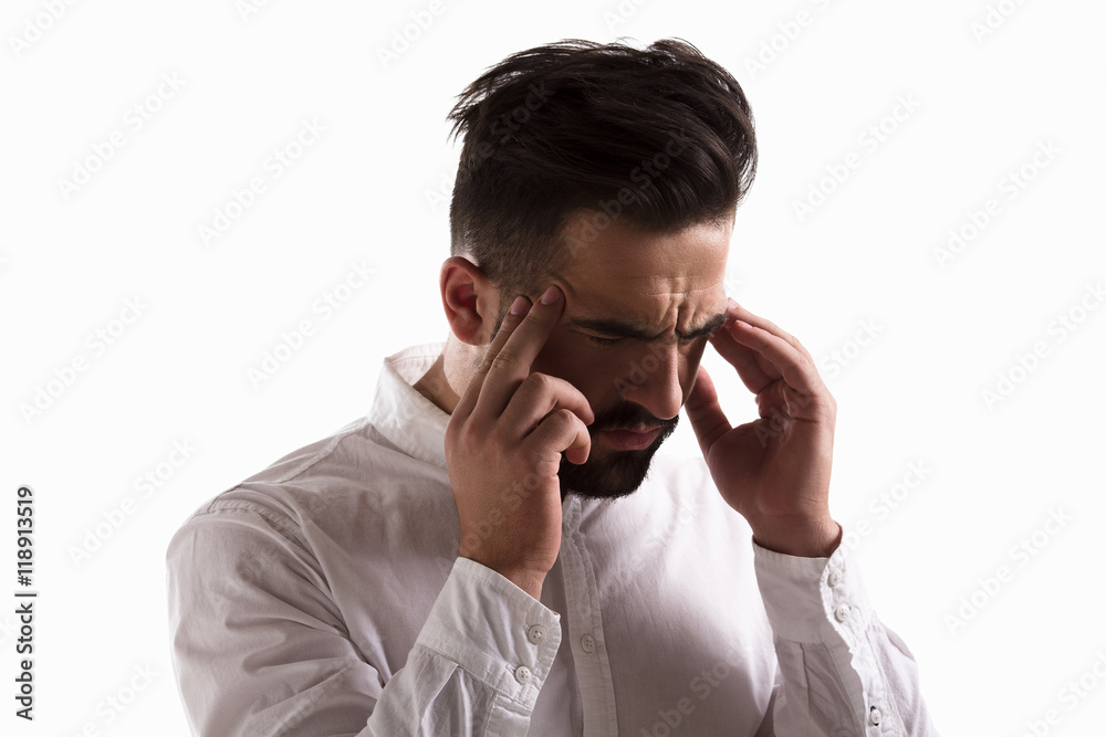 Portrait of thoughtful handsome man touching hishead while thinking about something isolated on white background in studio. Portrait of thoughtful handsome man touching hishead while thinking about something isolated on white background in studio.
