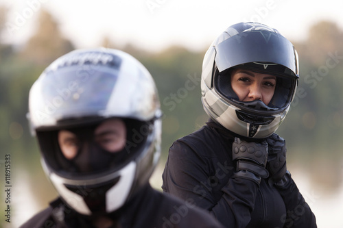 Bikers, boy and girl in helmets © Markomarcello