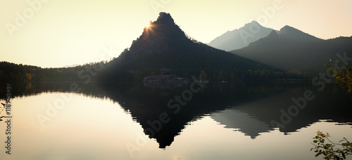 Silhouette of cliff Okzhetpes at sunset in Natonal park Burabay (Borovoe), Kazakhstan  photo