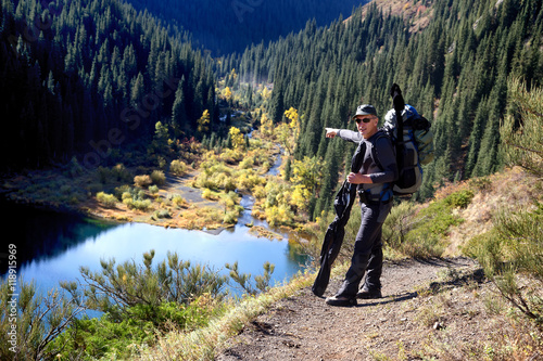 Backpacker on the Kolsay Lake in Tien-Shan mountain, Kazakhstan