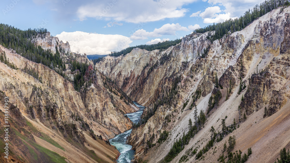 View at a vivid Grand Canyon of the Yellowstone and Yellowstone river. Brink of the Lower Falls on the Grand Canyon of the Yellowstone, Yellowstone National Park, Wyoming View at a vivid Grand Canyon of the Yellowstone and Yellowstone river. Brink of the Lower Falls on the Grand Canyon of the Yellowstone, Yellowstone National Park, Wyoming