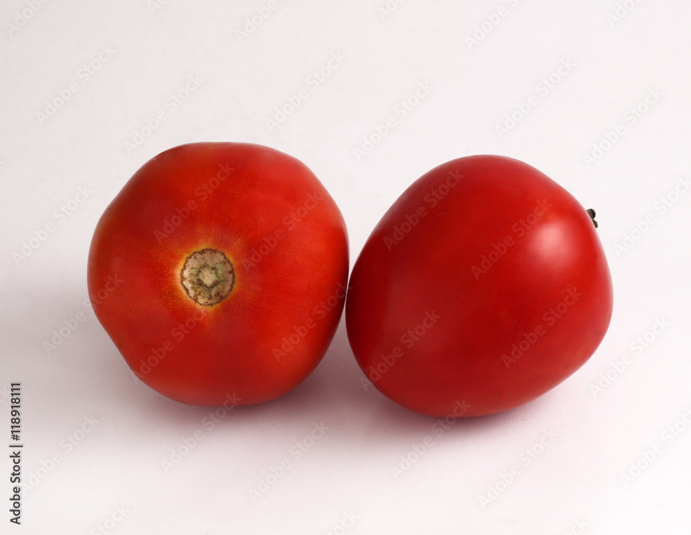 Fresh red tomatoes on the white background Fresh red tomatoes on the white background
