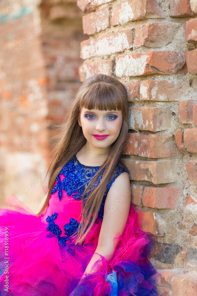 fashion photo of a beautiful girl on a background of brick ruin fashion photo of a beautiful girl on a background of brick ruin