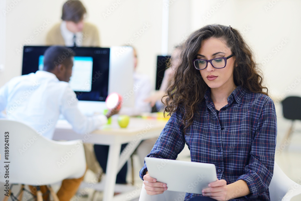 portrait of young business woman at modern startup office interior, team in meeting in background portrait of young business woman at modern startup office interior, team in meeting in background