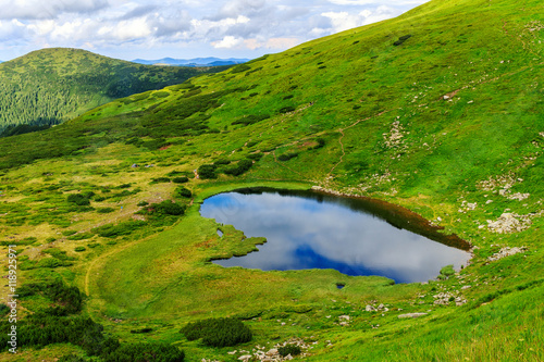 Carpathian mountains landscape, view from the height, Nesamovyte lake under hill.