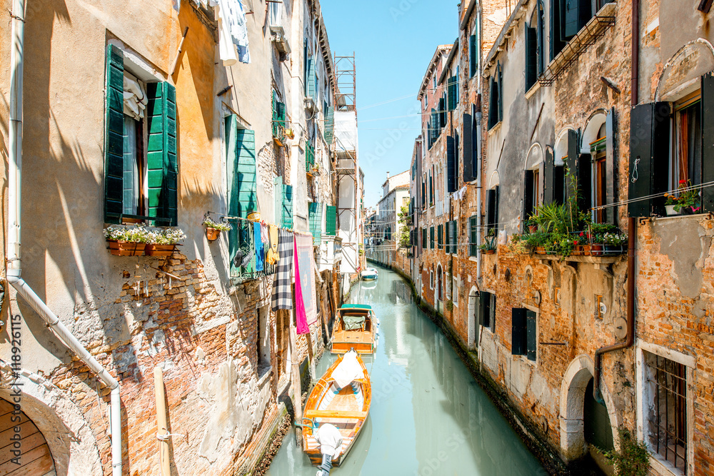 Small romantic water canal in Castello region in Venice
