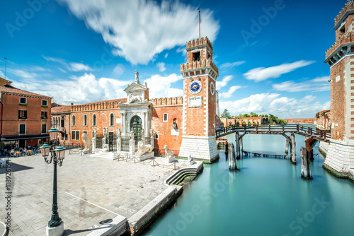 Venetian Arsenal in Castello region in Venice. Long exposure image technic with motion blurred clouds photo