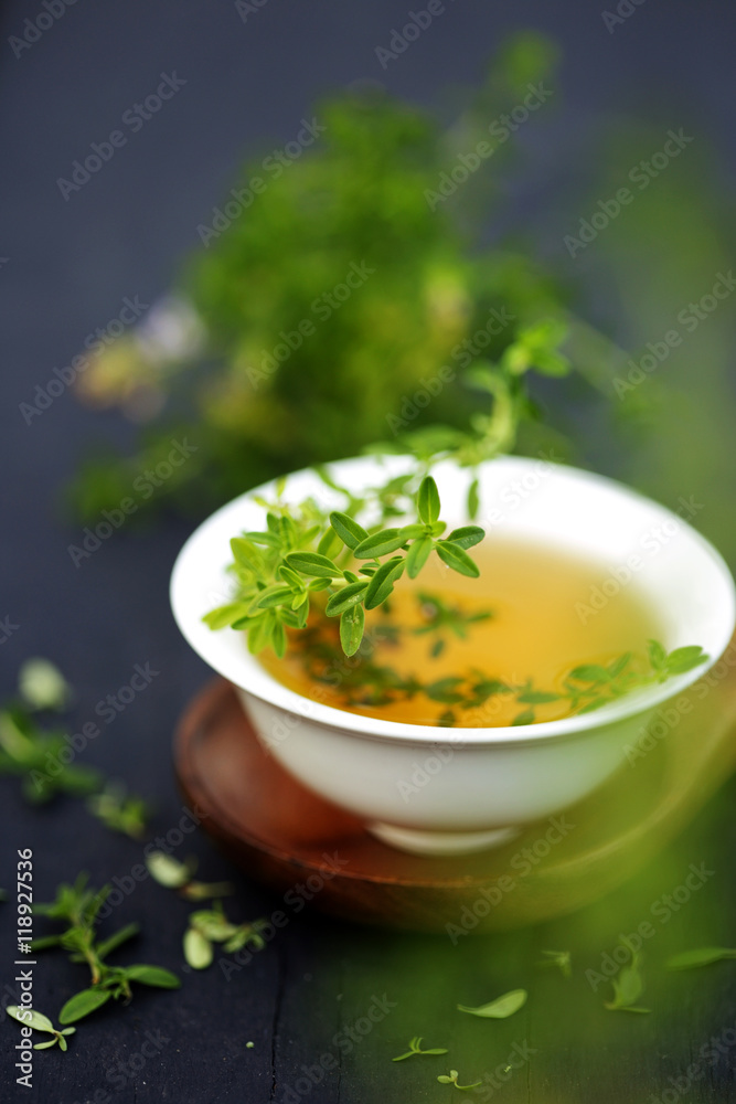 Thyme leaves isolated on dark background with copy space Thyme leaves isolated on dark background with copy space