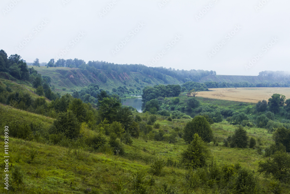 Fototapeta premium Landscape with a river and hills