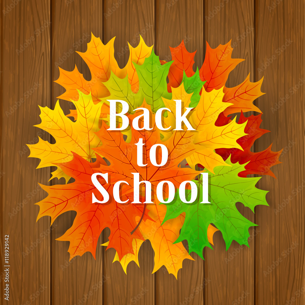 Inscription Back to School and maple leaves on wooden background Inscription Back to School and maple leaves on wooden background