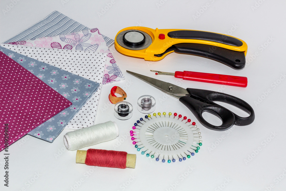 Composition of instruments, objects and fabrics for patchwork an Composition of instruments, objects and fabrics for patchwork an