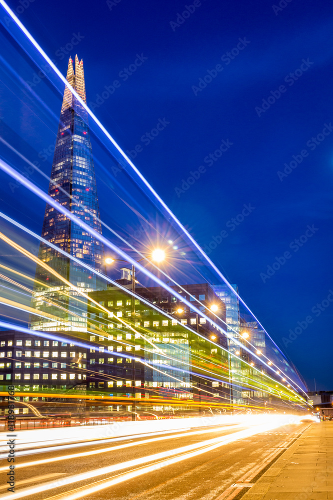 Fototapeta premium Shard skyscraper at night seen through traffic lights. London, The United Kingdom