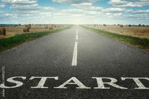 The road stretches into the distance with an inscription start