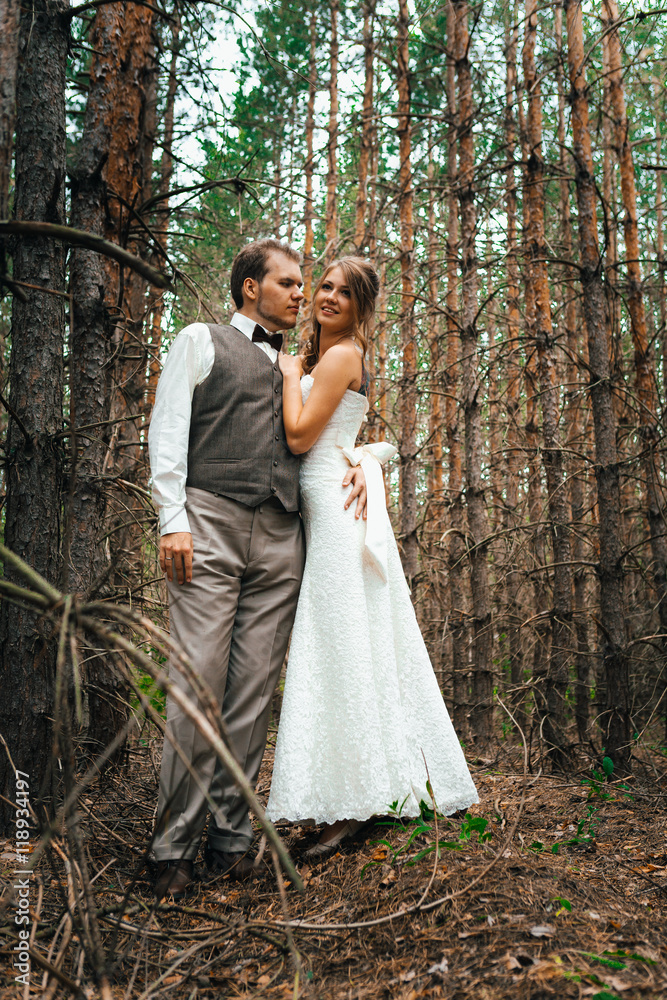 dramatic picture bride and groom on the background of leaves forest backlight dramatic picture bride and groom on the background of leaves forest backlight