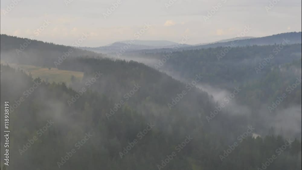 fog in the mountains at dawn, the Siberian forest, time lapse