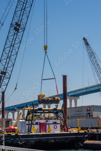 loading or discharging tower crane at a sea port photo