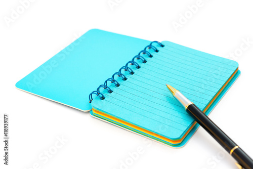 pen and colorful notebook on white