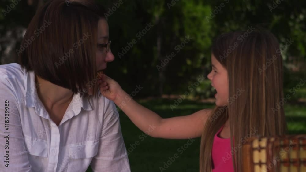 Mother and daughter having a picnic in the park - 4k Mother and daughter having a picnic in the park - 4k