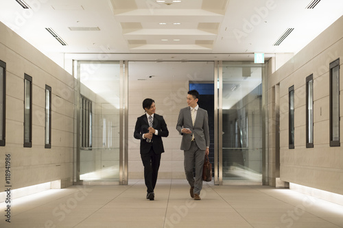 Businessman has entered the building while walking 