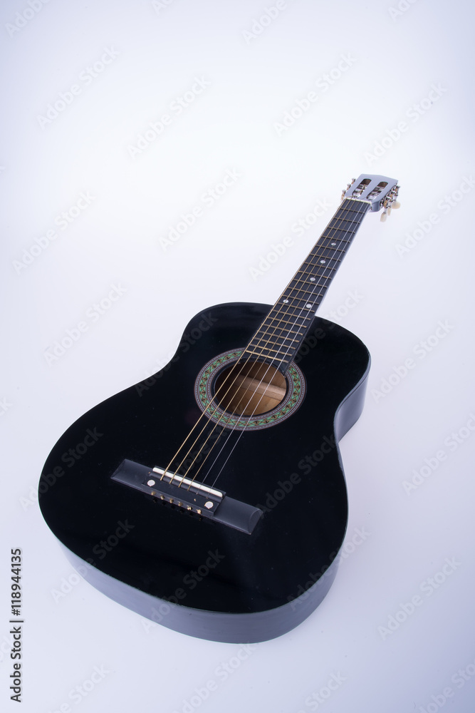Fototapeta premium guitars or black color guitars on a background.