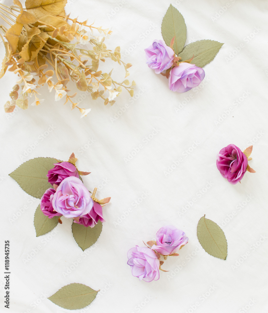 Purple flowers on white fabric background