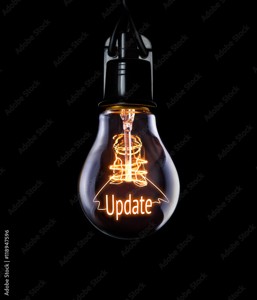Hanging lightbulb with glowing Update concept.