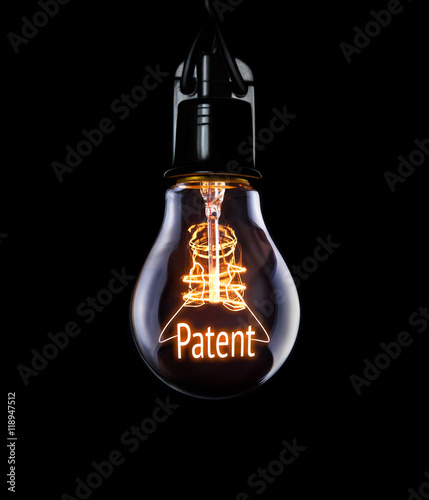 Hanging lightbulb with glowing Patent concept.