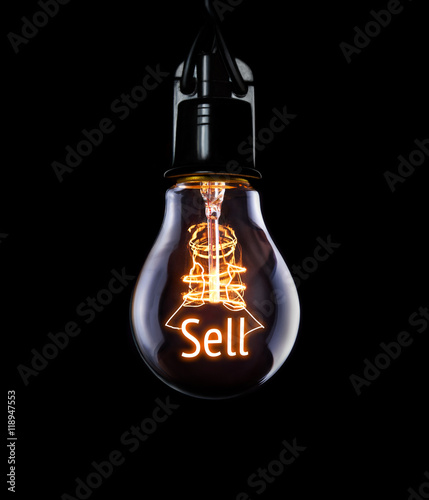 Obraz na płótnie Hanging lightbulb with glowing Sell concept. w salonie