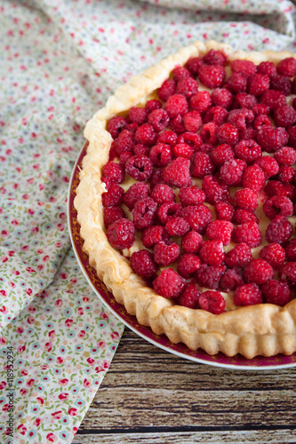 Cake eclair with raspberry