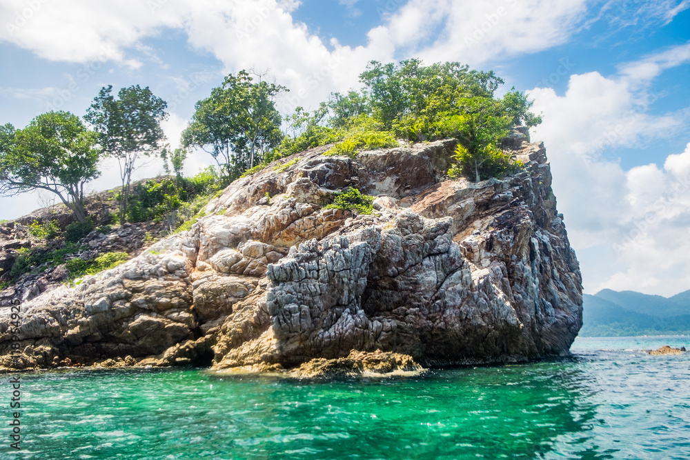 Crag rock cliff with emerald sea in ko lipe,andaman,thailand