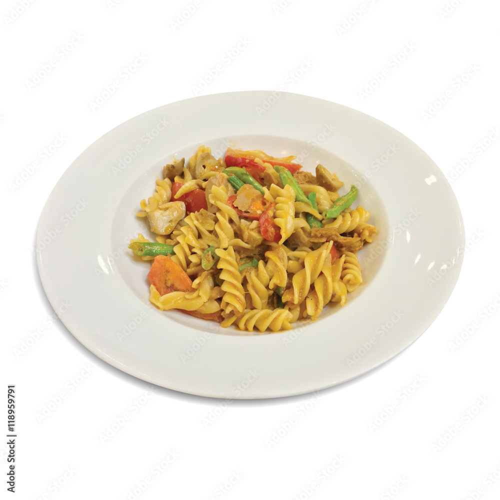 Fusilli with carrots and fresh tomatoes in white dish background.