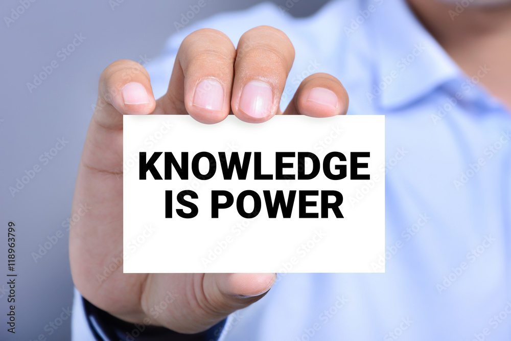 KNOWLEDGE IS POWER message on the card shown by a man KNOWLEDGE IS POWER message on the card shown by a man