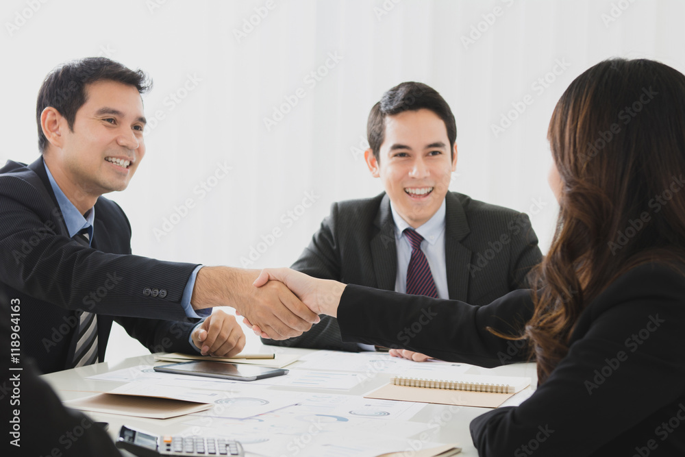 Businesspeople making handshake in the meeting Businesspeople making handshake in the meeting