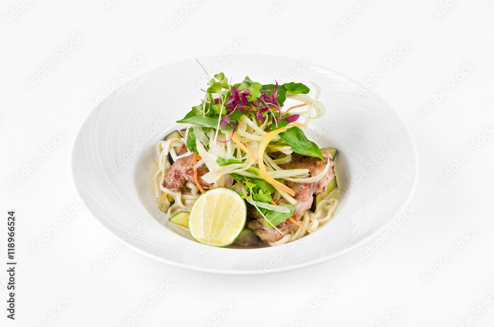 Fillet of sea bass with roasted eggplant and olives on a plate on a white background Fillet of sea bass with roasted eggplant and olives on a plate on a white background