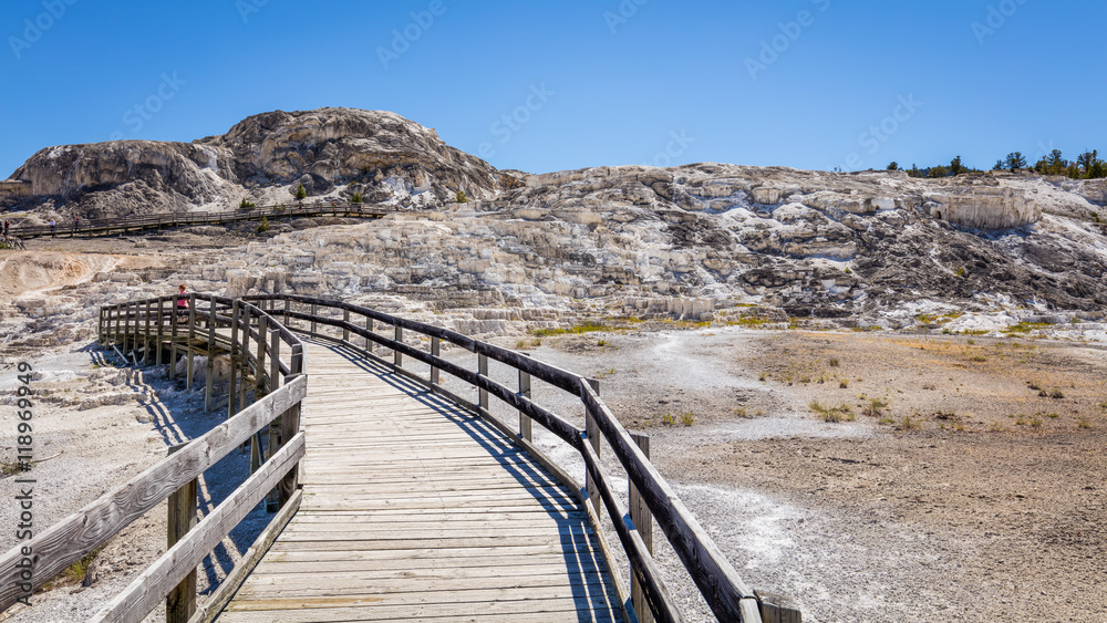 Wooden walkway in a beautiful landscape of Mammoth Hot Springs, Yellowstone National Park, Wyoming, USA