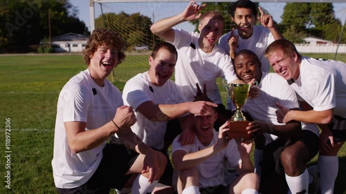 High school boys playing soccer in the park - 4K