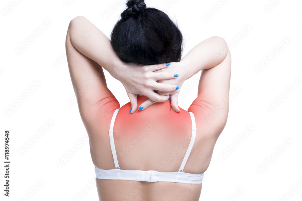 Young caucasian woman in bra with pain in shoulders and neck, ache in the human  body, isolated on white background Stock Photo
